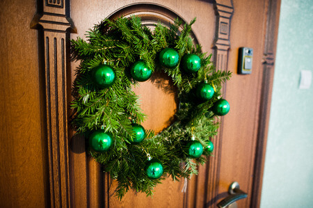 50625796 - christmas wreath on brown wooden door